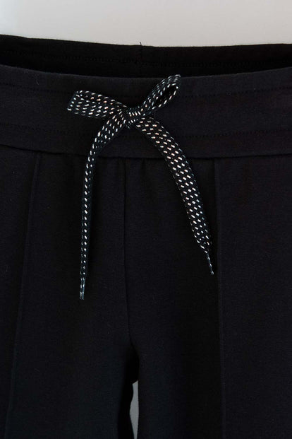 JOGGER DE MIC CON CORDÓN NEGRO PARA NIÑA